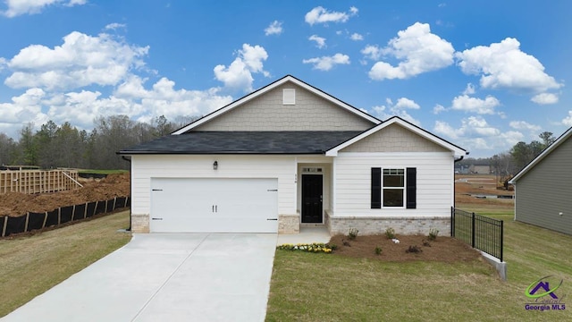 view of front of house with an attached garage, driveway, and a shingled roof