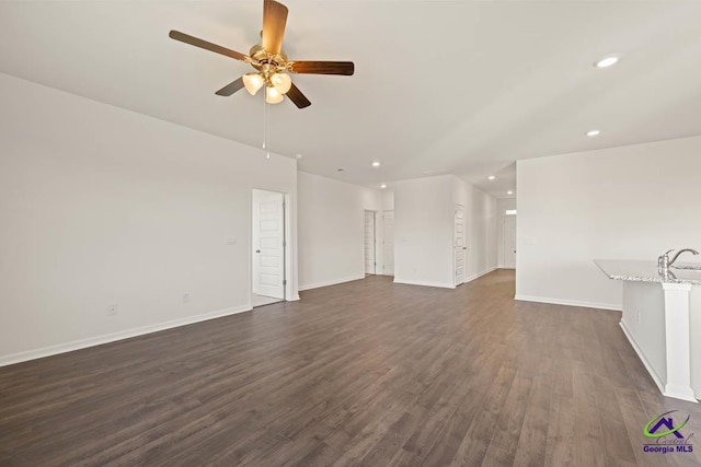 unfurnished living room featuring a ceiling fan, dark wood-style floors, recessed lighting, and baseboards