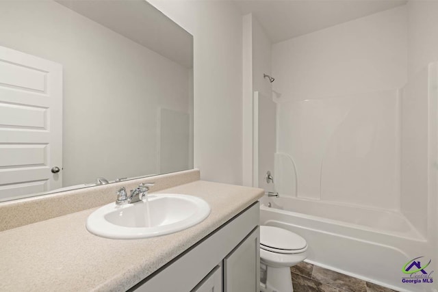 full bathroom with toilet, vanity, and washtub / shower combination