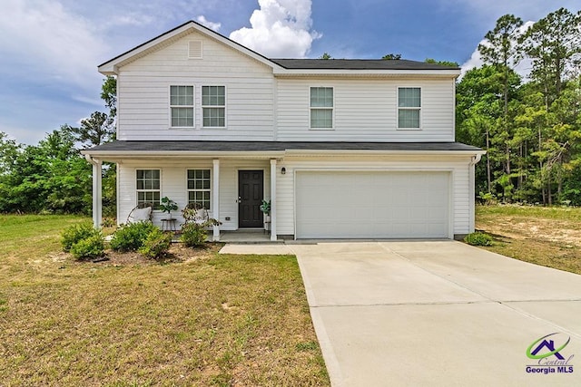 1707 Hannah Ct, Macon, GA 31217 - traditional home featuring a garage, a porch, a front yard, and concrete driveway