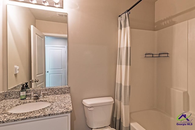 1707 Hannah Ct, Macon, GA 31217 - full bath with toilet, vanity, and shower / bathtub combination with curtain