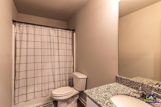 1707 Hannah Ct, Macon, GA 31217 - bathroom with toilet, vanity, and baseboards