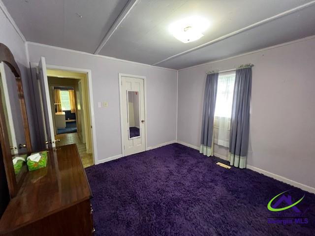 726 Mcarthur Blvd, Warner Robins, GA 31093 - unfurnished bedroom with carpet flooring and baseboards