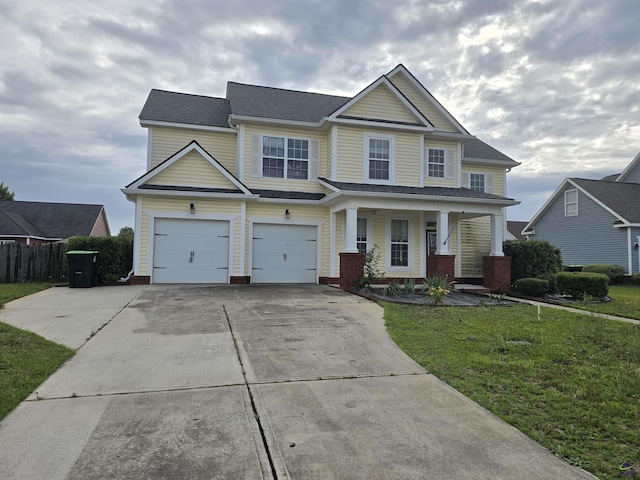 212 Raleigh Dr, Warner Robins, GA 31088 - view of front of house with concrete driveway and covered porch