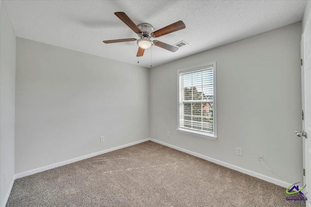 212 Raleigh Dr, Warner Robins, GA 31088 - unfurnished room with carpet flooring, a ceiling fan, baseboards, and a textured ceiling