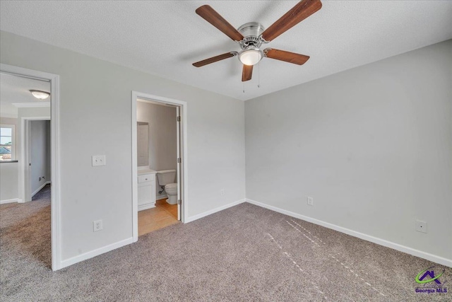 212 Raleigh Dr, Warner Robins, GA 31088 - unfurnished bedroom with carpet, baseboards, and ensuite bath