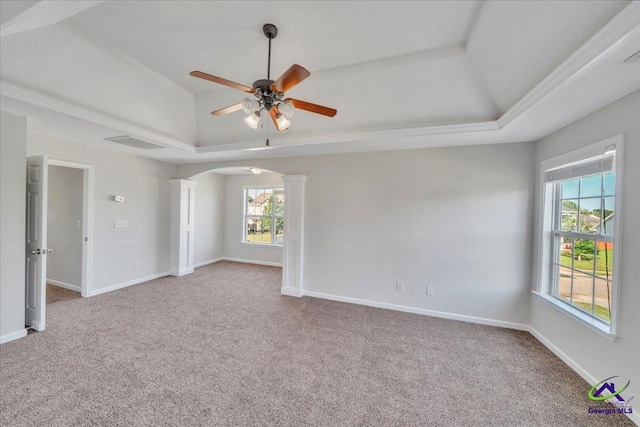 212 Raleigh Dr, Warner Robins, GA 31088 - carpeted empty room with a raised ceiling, ornate columns, plenty of natural light, and ceiling fan