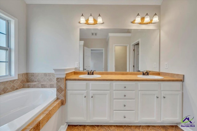 212 Raleigh Dr, Warner Robins, GA 31088 - full bath featuring plenty of natural light, a garden tub, and double vanity