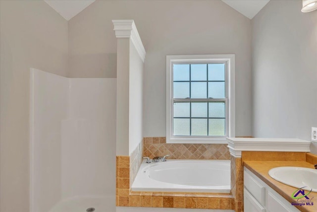 212 Raleigh Dr, Warner Robins, GA 31088 - full bathroom with vaulted ceiling, walk in shower, a bath, and vanity