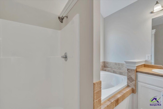 212 Raleigh Dr, Warner Robins, GA 31088 - full bathroom featuring a shower, vanity, and a garden tub