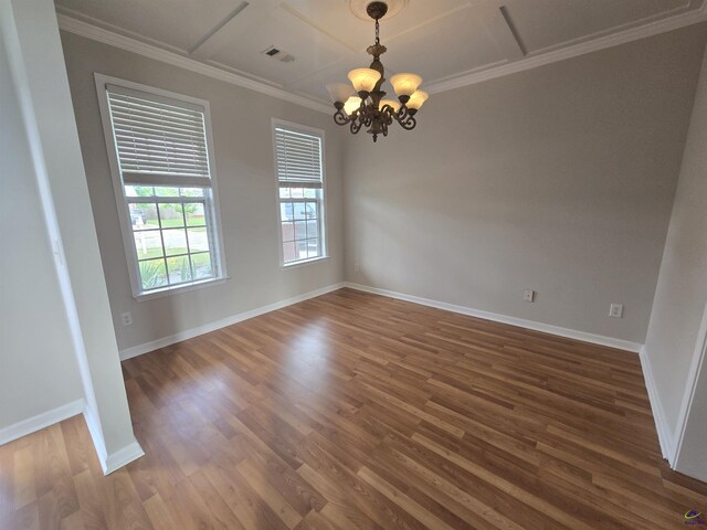 212 Raleigh Dr, Warner Robins, GA 31088 - empty room with a chandelier, wood finished floors, baseboards, coffered ceiling, and crown molding