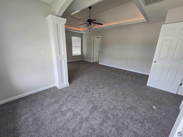 212 Raleigh Dr, Warner Robins, GA 31088 - empty room with a ceiling fan, dark colored carpet, ornate columns, and baseboards
