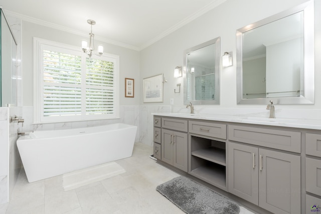 full bath featuring crown molding, a chandelier, double vanity, a soaking tub, and a shower with door