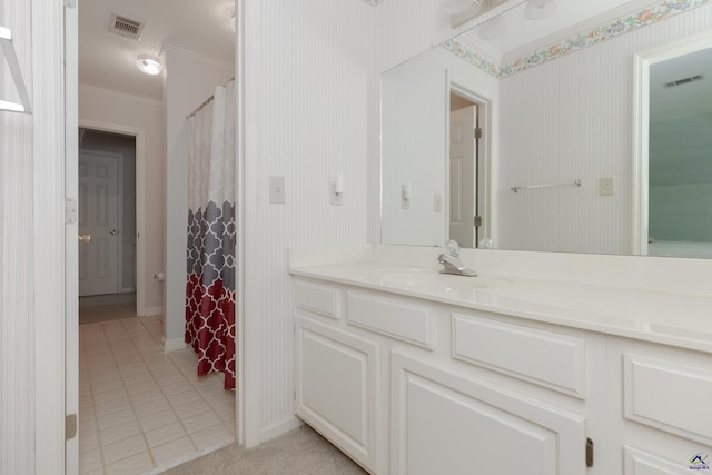bathroom with ornamental molding, tile patterned floors, vanity, baseboards, and wallpapered walls