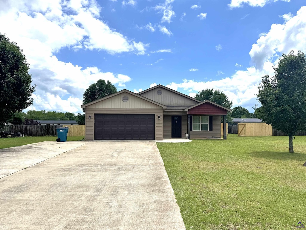 ranch-style home with driveway and an attached garage