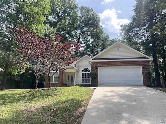 1187 Camden Ct, Warner Robins, GA 31088 - view of front of property featuring driveway, an attached garage, brick siding, and a front yard