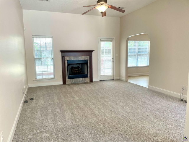 1187 Camden Ct, Warner Robins, GA 31088 - unfurnished living room with carpet, ceiling fan, a fireplace, and baseboards