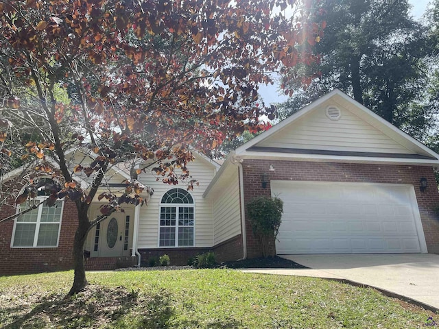 1187 Camden Ct, Warner Robins, GA 31088 - ranch-style home with brick siding, driveway, a garage, and a front lawn