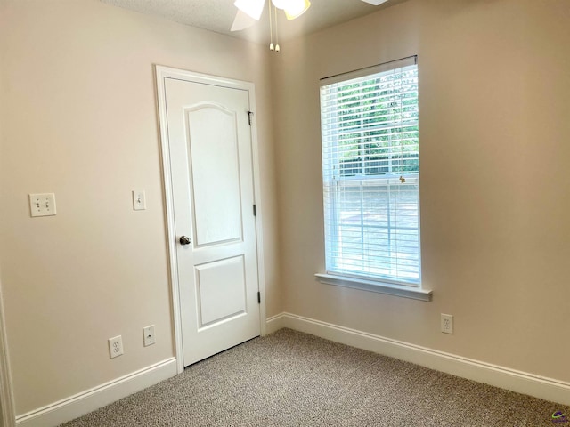 1187 Camden Ct, Warner Robins, GA 31088 - spare room featuring light carpet, ceiling fan, and baseboards