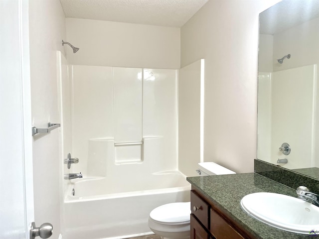 1187 Camden Ct, Warner Robins, GA 31088 - bathroom featuring tub / shower combination, toilet, vanity, and a textured ceiling