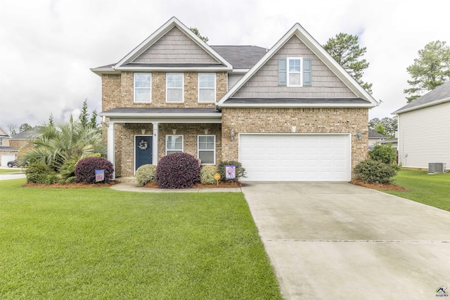 craftsman-style home featuring a garage, a front lawn, concrete driveway, brick siding, and cooling unit