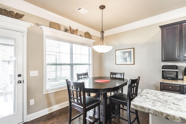 dining area with baseboards, plenty of natural light, dark wood-style flooring, and ornamental molding