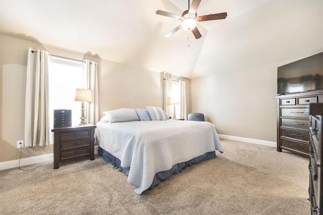 bedroom featuring baseboards, carpet floors, a ceiling fan, and vaulted ceiling