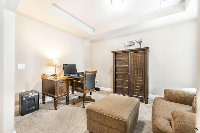 home office featuring carpet, baseboards, and a raised ceiling