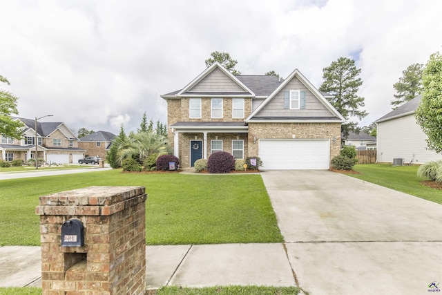 craftsman-style home featuring concrete driveway, a front lawn, central air condition unit, and an attached garage
