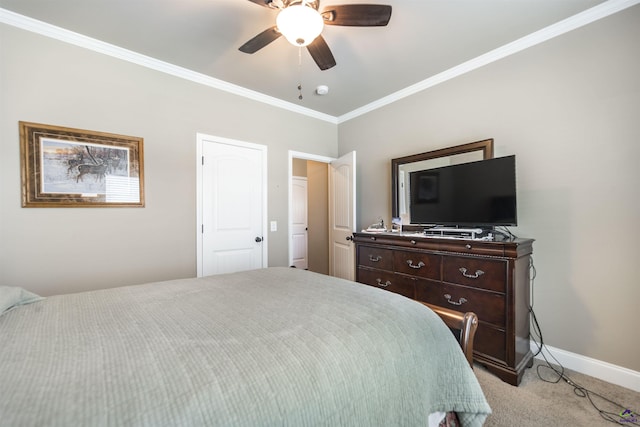 bedroom featuring light colored carpet, ornamental molding, baseboards, and a ceiling fan