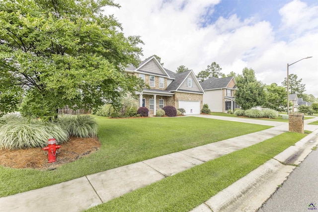 view of front of house featuring concrete driveway, a garage, and a front lawn