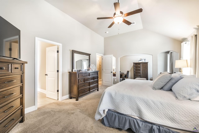 bedroom featuring light carpet, arched walkways, high vaulted ceiling, baseboards, and ceiling fan