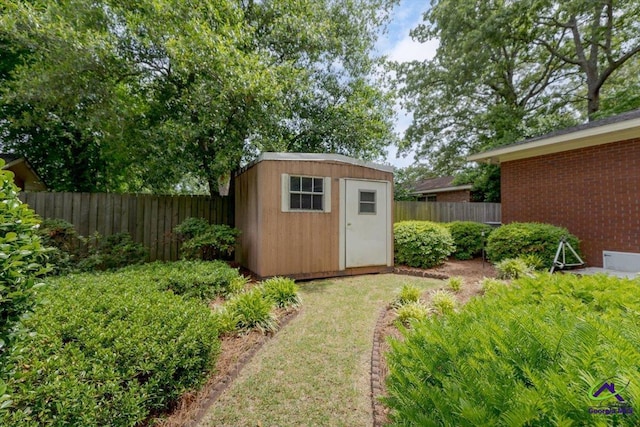 view of shed featuring a fenced backyard