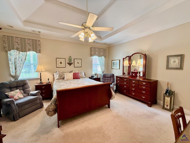 bedroom with a raised ceiling, light carpet, ornamental molding, and ceiling fan
