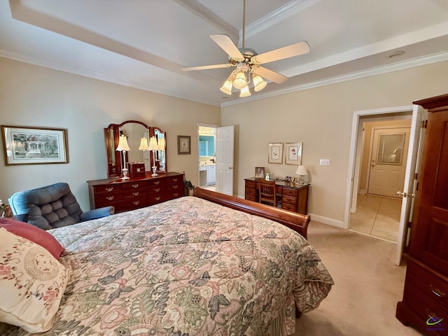 bedroom featuring ornamental molding, light carpet, a tray ceiling, baseboards, and ceiling fan