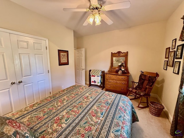 carpeted bedroom featuring ceiling fan and baseboards