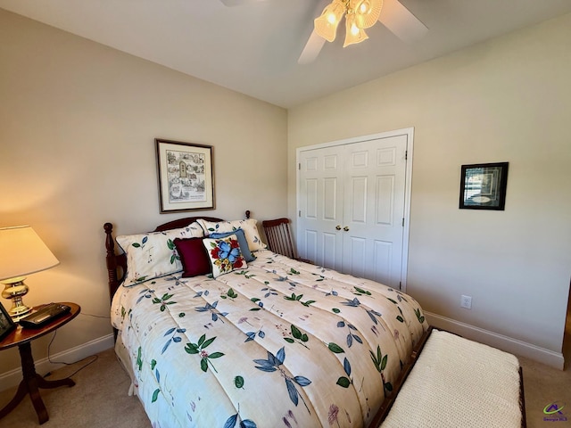 carpeted bedroom with baseboards, a ceiling fan, and a closet