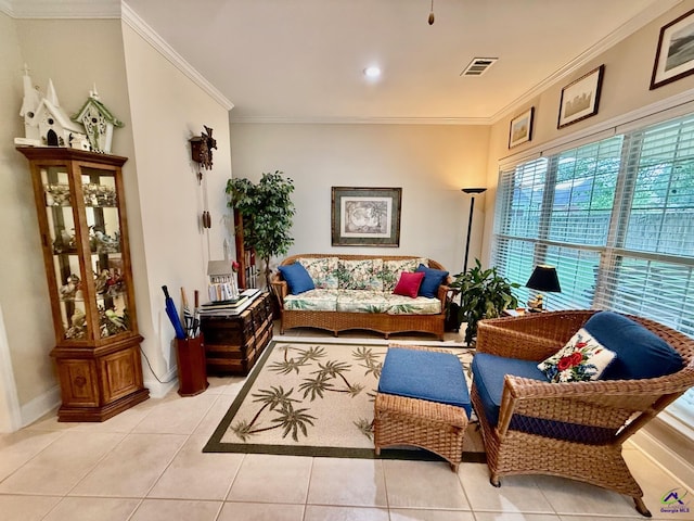 living area featuring ornamental molding, light tile patterned flooring, and baseboards