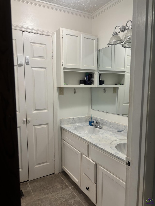 174 Cabero Rd, Hawkinsville, GA 31036 - bathroom with crown molding, double vanity, and a textured ceiling
