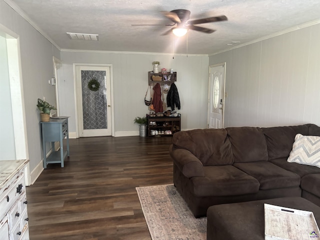 174 Cabero Rd, Hawkinsville, GA 31036 - living room featuring dark wood finished floors, ceiling fan, crown molding, baseboards, and a textured ceiling