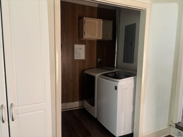 174 Cabero Rd, Hawkinsville, GA 31036 - washroom featuring washer and clothes dryer, electric panel, dark wood finished floors, and wooden walls