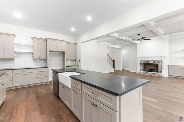 615 Head Rd, Juliette, GA 31046 - kitchen with dark countertops, ceiling fan, dishwasher, tasteful backsplash, and beam ceiling