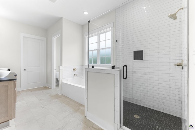 615 Head Rd, Juliette, GA 31046 - bathroom featuring a shower stall, vanity, a garden tub, and marble finish floors
