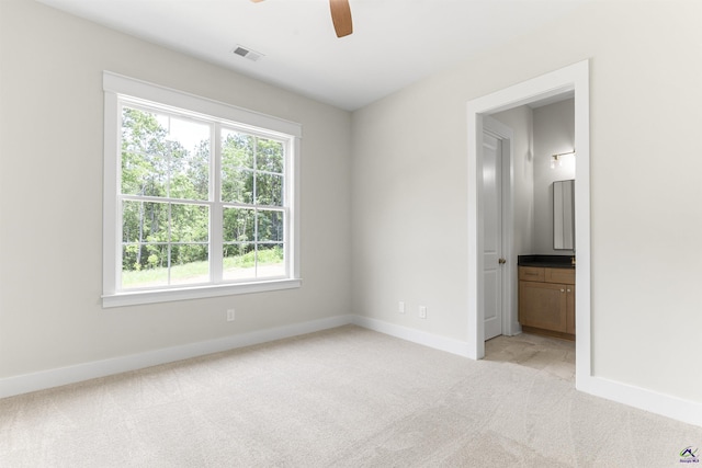 615 Head Rd, Juliette, GA 31046 - unfurnished bedroom with light carpet, multiple windows, ensuite bathroom, and a ceiling fan