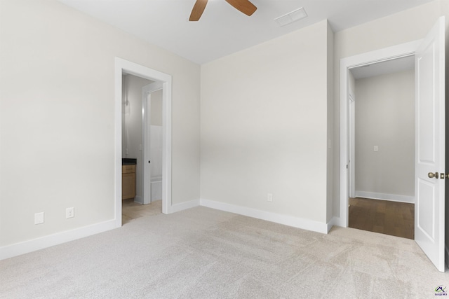 615 Head Rd, Juliette, GA 31046 - unfurnished bedroom with carpet floors, ensuite bathroom, and a ceiling fan