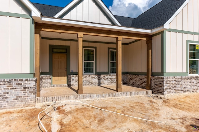 615 Head Rd, Juliette, GA 31046 - entrance to property featuring a shingled roof, board and batten siding, brick siding, and a porch