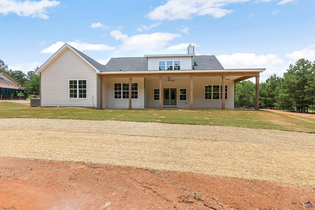 615 Head Rd, Juliette, GA 31046 - back of property featuring a ceiling fan, a lawn, and a chimney