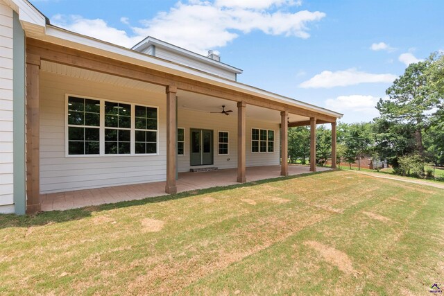 615 Head Rd, Juliette, GA 31046 - rear view of house with ceiling fan, a lawn, and a patio area
