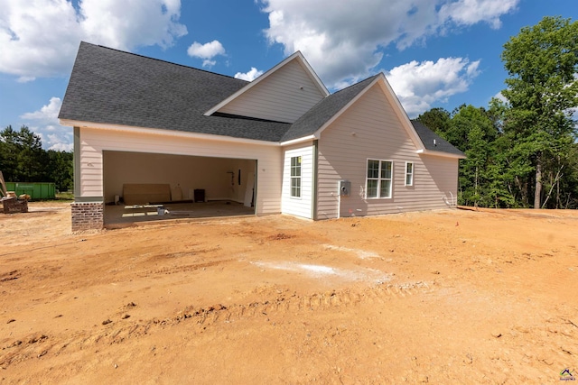 615 Head Rd, Juliette, GA 31046 - back of property with a garage, a shingled roof, and driveway