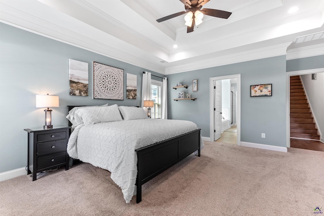 bedroom with light colored carpet, baseboards, crown molding, a tray ceiling, and recessed lighting